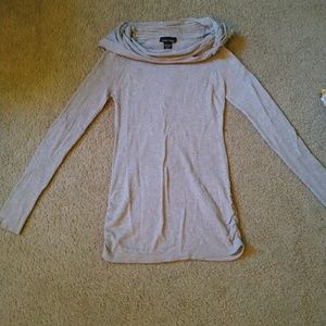 Grey turtle neck sweater .